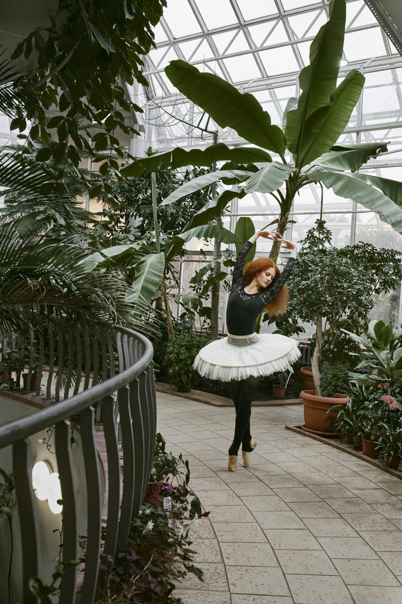 young female ballerina dancing indoors botanical garden 1